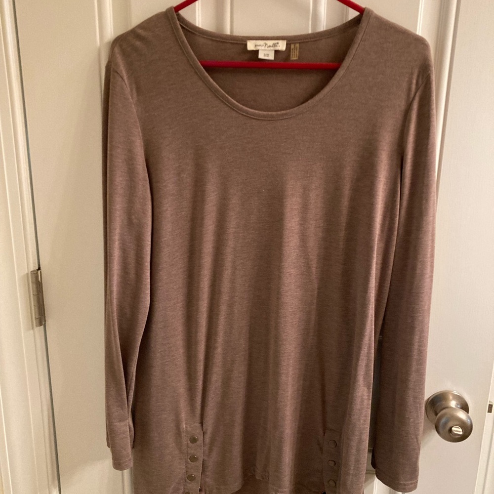 Top was worn with black leggings and boots